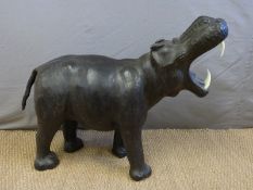 A large Liberty style leather footrest in the form of a hippo,