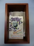 A collection of postcards in a mahogany box including Edwardian onwards, Cheapside London,