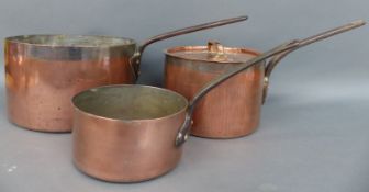 Three 19thC copper sauce pans and a lid to suit the mid size example,