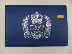 A Silver Jubilee stamp album,