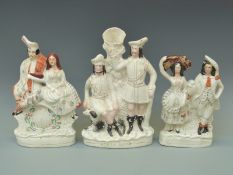 Three 19thC Staffordshire figures including a Robin Hood spill vase,