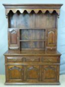 A 19thC style mahogany dresser, the pedestal top with apron freeze,