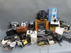 A quantity of collectable cameras to include Polaroid and other instant cameras,