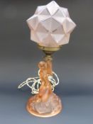 Czech Art Deco glass figural lamp in the form of a couching female nude with geometric shade,