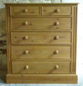 A large pine chest of two drawers over four graduated drawers,