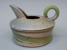 A studio pottery salt glazed stoneware jug by Jane Hamlyn with impressed mark, approximately 8.