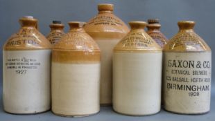 Seven flagons including 1927 dated Pickup & Co, Bristol, 1929 Markham & Roberts Limited,