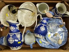 Three graduated blue and white jugs,