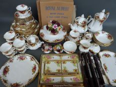 A large collection of Royal Albert Old Country Roses dinner and tea ware, tea and coffee pots,