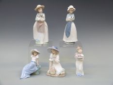 Five Nao figurines comprising a girl kneeling with flower basket, two girls with puppies,