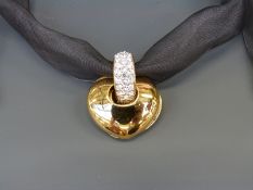 Swarovski Crystal pendant in the form of a gilt metal heart with white and red crystals,