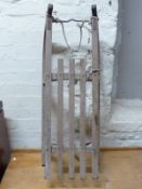 A vintage sled with metal bound runners,