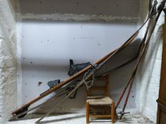 A pair of vintage wooden skis and bamboo poles,