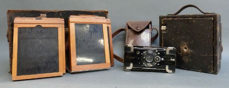 An Eastmon Kodak folding bellows camera and film/plate carriers and a No 2 Ensignette De Luxe