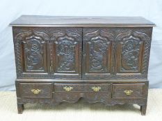 An 18th/19thC carved oak converted mule chest with three drawers below cupboard doors,