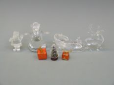 Four Swarovski Crystal Christmas items comprising an angel, Father Christmas,