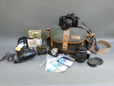 A Canon EOS 5000 camera with 38-76mm and a 80-200mm lenses, Canon Powershot A480,