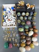 A collection of various agate, turned mineral and cloisonné eggs, thimbles,