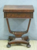 A 19thC mahogany fold over games table with single drawer raised on a quatrefoil base,