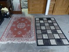Two rugs, one pink and one black,