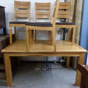 A contemporary light oak table and four upholstered chairs (approximately 18 months old) H75 x L150