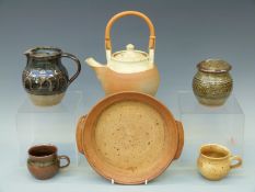 Six pieces of Winchcombe studio pottery to include teapot, jug, lidded pot,