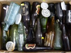 A collection of old beer bottles including Cheltenham & Hereford Brewery and assorted ceramic pot