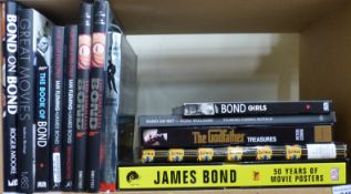 A large collection of James Bond coffee table size books etc together with other movie books,