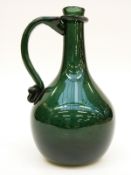 George Elliot green glass ewer with applied glass handle, signed and dated 1990 to base, 20cm tall.