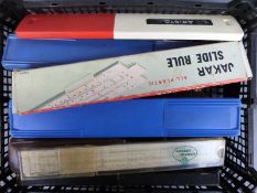 Approximately 25 various slide rules