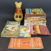 A collection of Rupert Bear annuals, book, comics and wobbly toy,