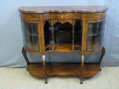 A 19thC bow fronted rosewood sideboard with glazed display cabinets and galleried shelf to centre,