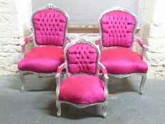A pair of silvered French style armchairs with pink velour button backs and a matching child's