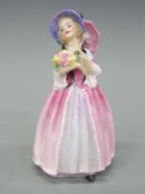 A Royal Doulton figurine June HN1691, dated 1942,