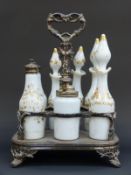 Opaline glass seven piece cruet set with gilt decoration named for salad oil, cayenne, anchovies,