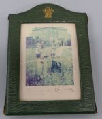 A framed Charles and Diana hand signed photograph showing each holding one of the Princes,