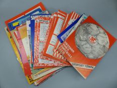 A collection of football ephemera including programmes for Swindon Town, Bristol Rovers,