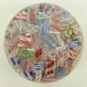 Baccarat style scrambled glass paperweight with various multi-coloured latticino lubes,