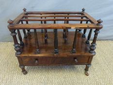 A 19thC walnut Canterbury with turned supports, three sections to top with drawer below,