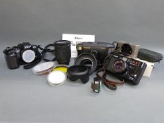 A quantity of cameras to include Nikon F-601 SLR, Tamron 28-200mm 1:3.8-5.