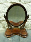 A swing framed toilet mirror, dressing table mirror with two hinged compartments,