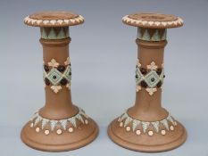 A pair of Doulton Silicon ware candlesticks,