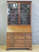 A 19thC astragal glazed bureau bookcase with adjustable shelves and fitted interior,