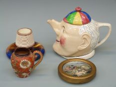 A collection of ceramics including Doulton Lambeth jug, Prattware 'Peace' pot lid,