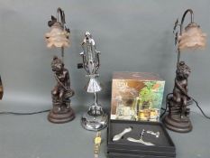 Two modern figural lamps, a glass drinks set, nativity,