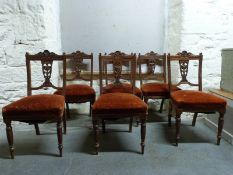 Six upholstered Edwardian mahogany dining chairs