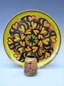 A Poole Pottery charger,