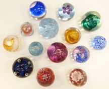 Fourteen Caithness glass paperweights mostly named, including Moonflower, Reflections, Carnival,