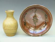 Two pieces of Winchcombe studio pottery to include green glaze vase with incised decoration,