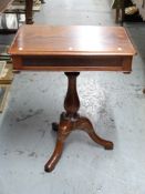 A mahogany side table with drawer